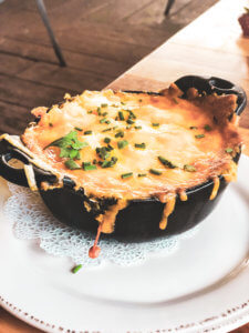 Homecomin' Kitchen at Disney Springs is the best restaurant at Disney World. With the best mac and cheese at Disney, the perfect water view, and a selection of resort cocktails and moonshine, this place cannot be beat. #disneyworld #disneysprings #disneyfood Disney food | Disney restaurants | Disney eats | Disney dining | Disney world restaurants | Disney springs restaurants | Disney springs food | Disney springs dining | Disney world food | Disney world dining | Homecoming Kitchen | Art Smith