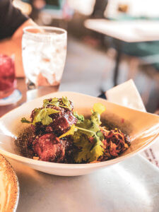 A Pixar-themed restaurant bar at Disney's California Adventure at Disneyland resort! Everything you need to know about the food, drinks, and Pixar details at Lamplight Lounge #disneyland #dlr #dca #disneycaliforniaadventure #disney Disney food | Disney restaurants | disneyland food | Lamplight lounge | best dinner at disneyland | best lunch at disneyland | bars at disneyland | pixar restaurant at disneyland | pixar bar at disneyland | disney eats | disney dining | disney food tips 